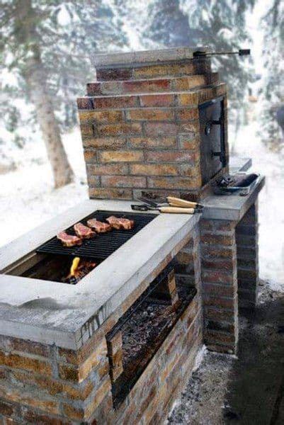 An Outdoor Bbq Grill In The Snow With Food Cooking On It S Side