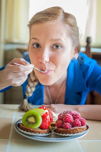 Woman Eating Fruit Cake Strawberry Tart And Raspberry Tart Stock Photo