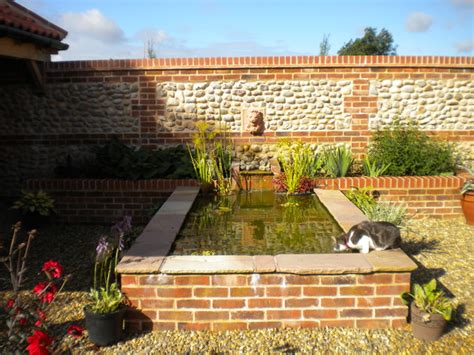 See more ideas about pond spitters, pond, water garden. Raised pond, water spout and rill - Mediterranean ...