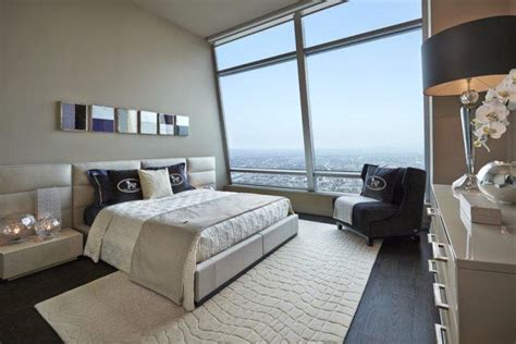 Luxury bedroom designs pictures open bedroom design with big bed and white two seat sofa dark small table and dark color chair. luxury-small-bedroom-interior-design-in-los-angeles ...