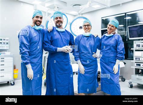 Portrait Of Successful Medical Workers In Surgical Uniform In Operation