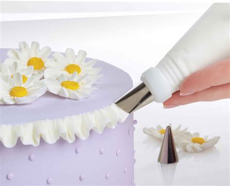 Cake piping nozzles are essential for cake decoration. Wilton 2109-0309 Ultimate Professional Cake Decorating Set ...