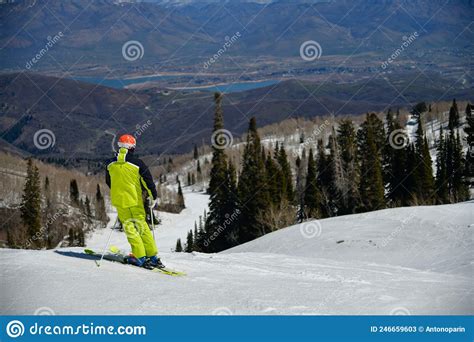Skiing Downhill On A Beautiful Sunny Day At Snowbasin Ski Resort Utah