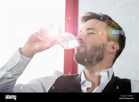 Young Businessman Thirsty Drinking Mineral Water Stock Photo Alamy