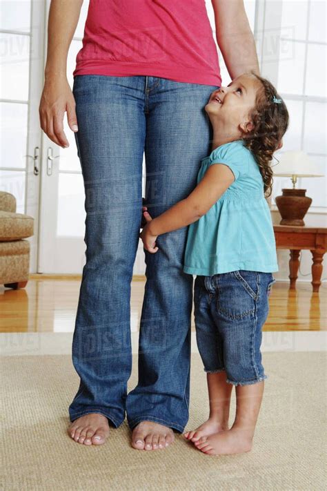 Girl Hugging Mothers Leg Stock Photo Dissolve Anxiety In Children