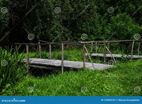 Old Wooden Bridge And Green Meadow Scenic Countryside Stock Image