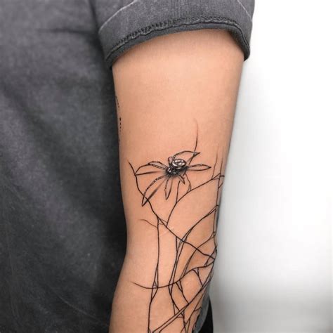Spider And Spider Web Tattoo On The Arm