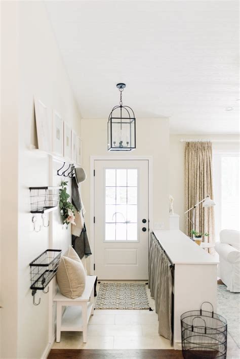 I wanted to make sure there was a table to set since it is definitely on the masculine side, i wanted to add a little girly touch to it. How We Upgraded Our Small Home Entryway - The Ginger Home