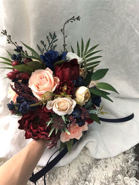 For the mother and father of the bride or groom, this real touch rose boutonniere and corsage set is accented with rhinestone and pearl accents with navy ribbon and can be customized for your color scheme. Wedding Bouquet Burgundy Navy Blue Red Peony Eucalyptus