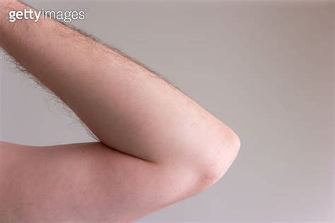 Caucasian Male Naked Arm And Elbow Joint Close Up Isolated