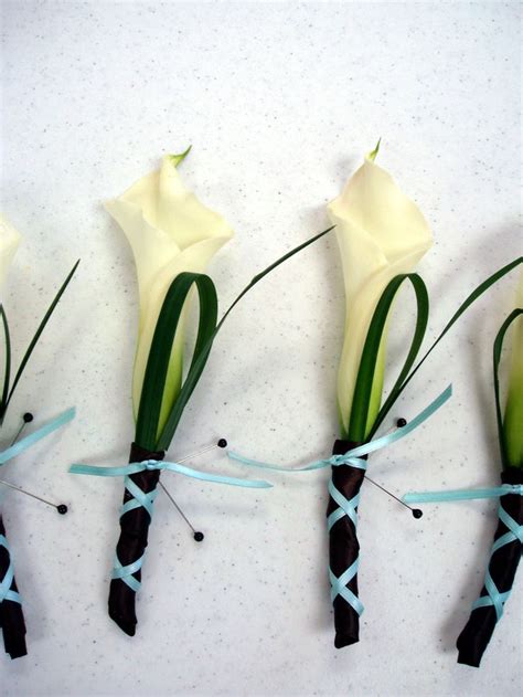 Mini Calla Lily Boutonnieres With Lily Grass Loop Finishes By Flowers