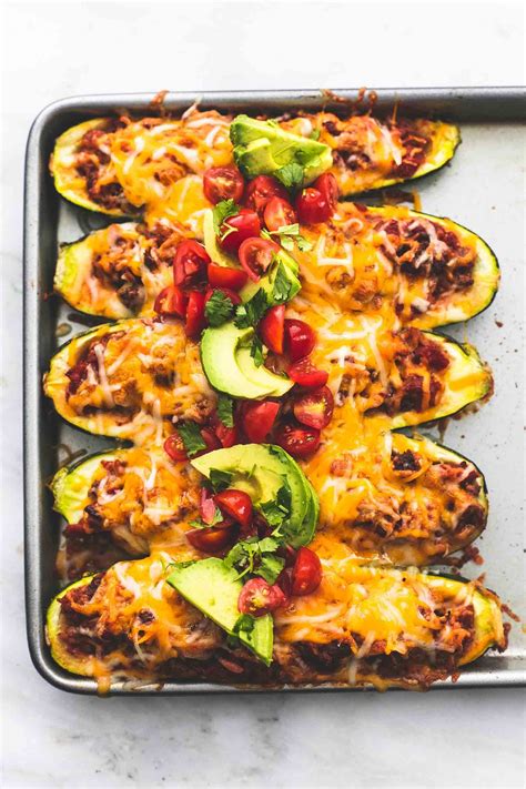 As a dietitian, i try to come up with nutritious twists on recipes, which is how these stuffed peppers were born. Super Easy Taco Stuffed Zucchini Boats loaded with cheesy ...