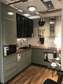 Lacquered L Shaped Ikea Kitchen With Wood Countertop And Glass Cabinets 