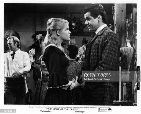 Candy Moore Looks Up At Clint Walker In A Scene From The Film The