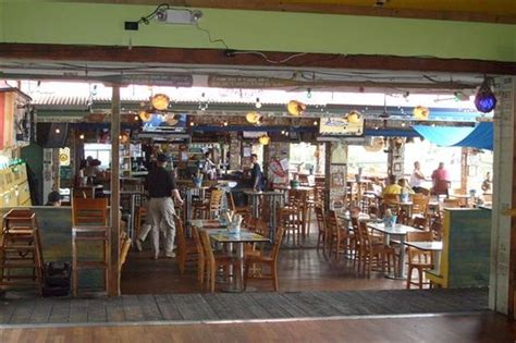 Their large dining deck is suspended over the shoreline; The Frisky Seal Surf Pub & Beach BBQ, Kailua-Kona - Menu ...