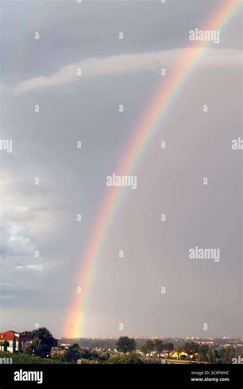 Colorful Rainbow On A Cloudy Sky Foggy Day Stock Photo Alamy