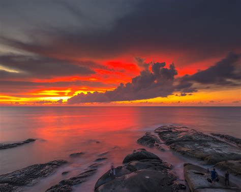 Red Sky Dark Clouds Reflection Sunset At The Coast Of Borneo Malaysia