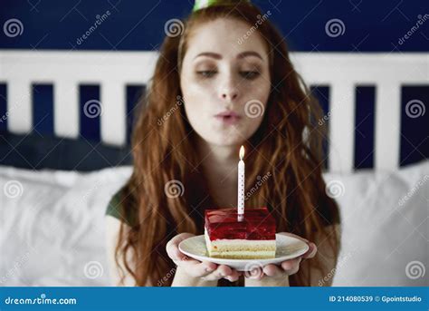 Redhead Woman Blowing A Birthday Candle On Cake Stock Image Image Of Home Celebration 214080539