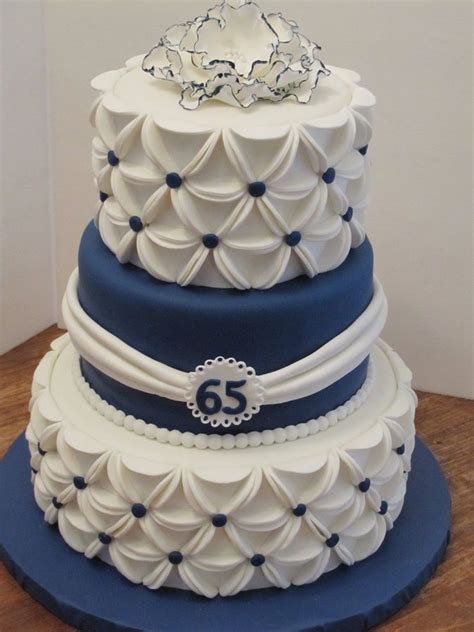 The moment of anniversary requires a lavish arrangement and cakes play a key role in that for sure. blue and white fondant covered cake | Wedding anniversary ...
