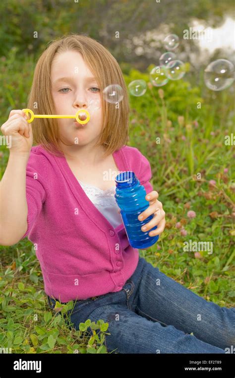 Young Girl Blowing Bubbles Stock Photo Alamy