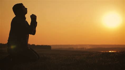 Young Man Praying At Sunset Seeking Solace Stock Footage Sbv 334343322