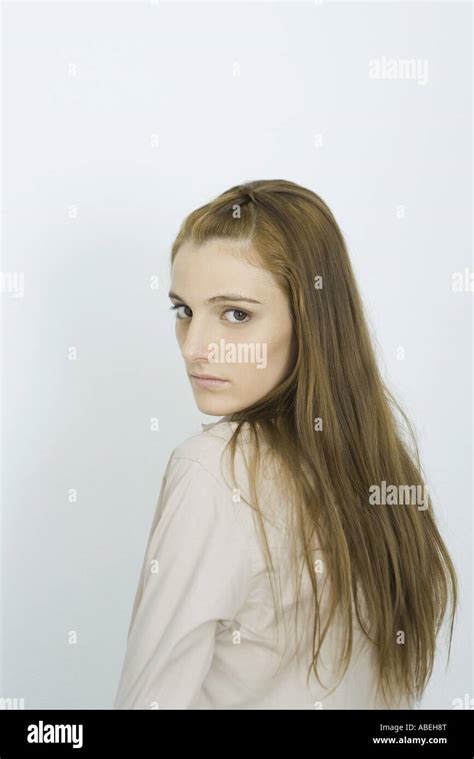 Teenage Girl Looking Over Shoulder At Camera Portrait Stock Photo Alamy