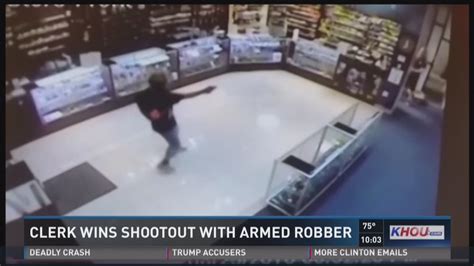 caught on camera clerk wins shootout with armed robber