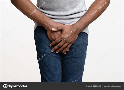 Close Up Of Black Man Holding His Crotch Stock Photo By ©milkos 326492870
