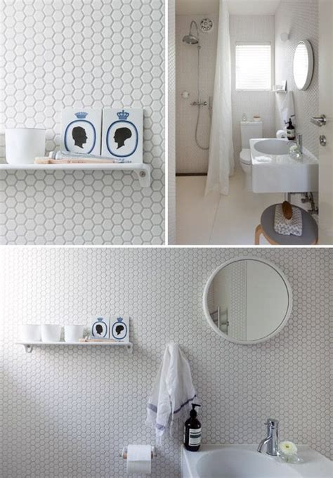 Cream and gray hexagon vanity wall tiles creates a striking backsplash for a black round vanity mirror illuminated by a round sconce over a marble floating trough sink in a transitional bathroom. 32 white hexagon bathroom tile ideas and pictures 2020