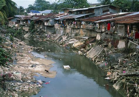 Water pollution are of various types such as Polluted River Running Through A Malaysian Slum Photograph ...
