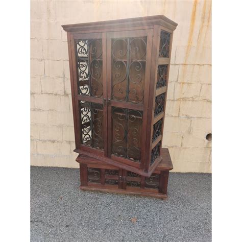 This rustic china cabinet is two pieces. Vintage Mediterranean Wood & Scrolled Wrought Iron 2-Piece ...