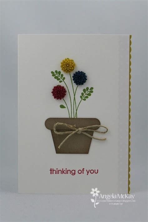 A Card With Flowers In A Pot On The Front And An Envelope That Says Thinking Of You