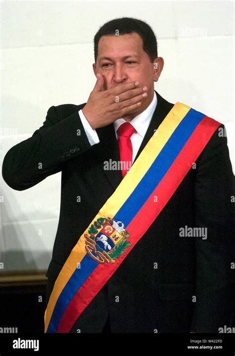 Venezuelan President Hugo Chavez Wearing A Venezuelan Flag Sends A