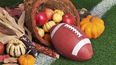 thanksgiving cornucopia with football on football field thanksgiving football games