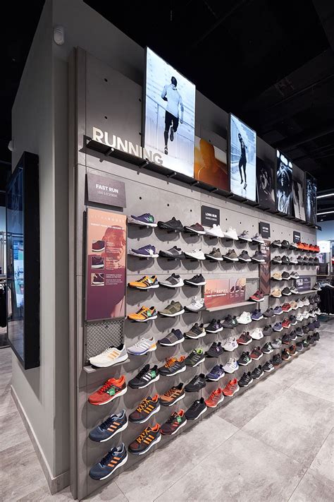 The Interior Of The Adidas Store Is Contemporary And Stylish To Suit