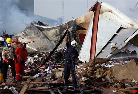 People gather at the site of a plane crash in lagos, nigeria, sunday, june 3, 2012. Engines failed before Nigerian plane crash | World News ...