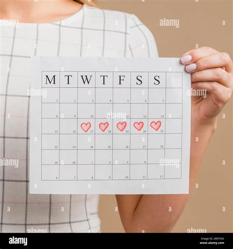 Close Up Period Calendar With Drawn Heart Shapes Stock Photo Alamy