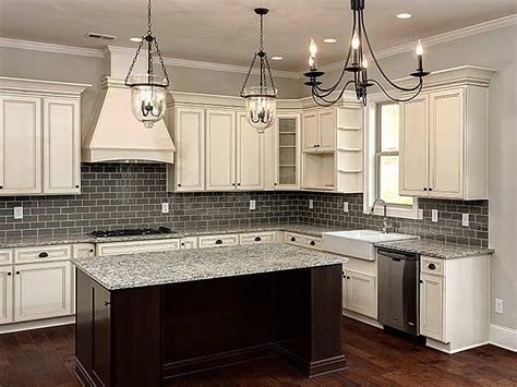 A kitchen update with a new hood, paint, cabinet pulls, lighting and some counterstools will go a long way in this kitchen! 6 Ways to Update Your Kitchen for 2016 | CabinetCorp