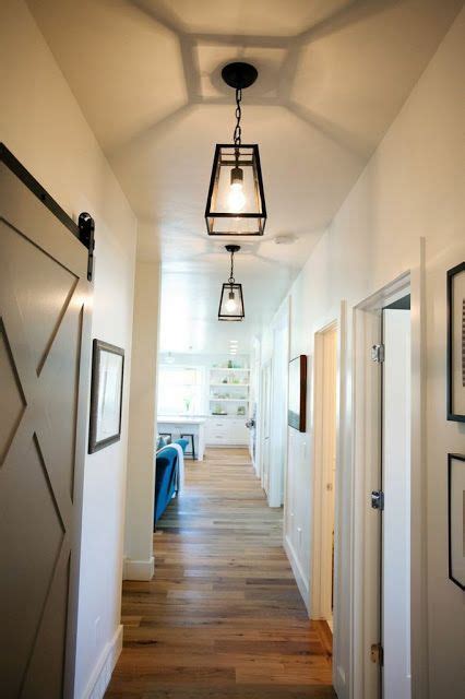 Place a lamp on your sideboard or hang a pendant light for a welcoming feel in your home. Caitlin Creer Interiors | Hallway light fixtures, Hallway ...