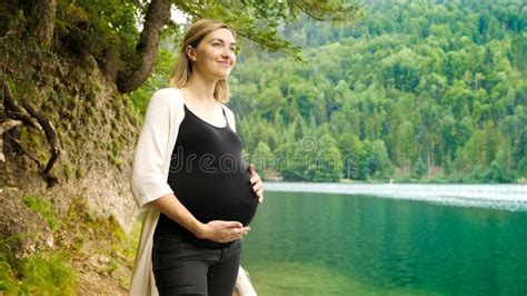 Beautiful Pregnant Woman Near A Mountain Lake In The Forest Stock Image Image Of Expectant
