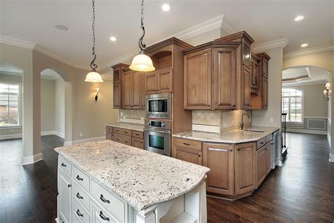 The tips for making two tones kitchen cabinet are: How to Coordinate Granite Countertops & Kitchen Cabinets ...