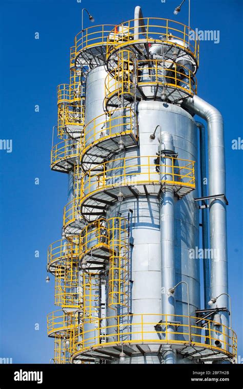 Close Up Of Oil Distillation Towers Refining Columns On Blue Sky