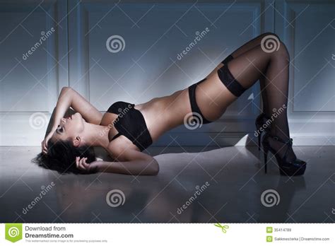 Brunette Woman Laying On Floor Royalty Free Stock Images