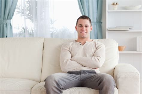 Premium Photo Man Sitting On A Couch