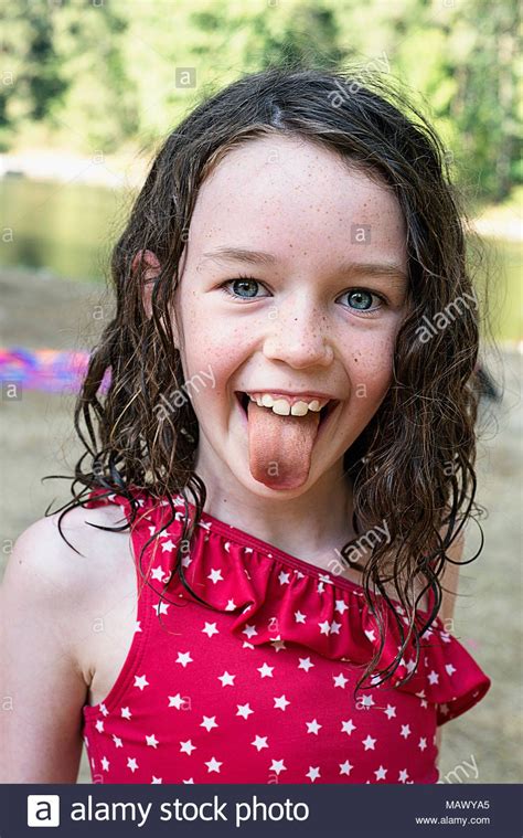 Download This Stock Image A Young Girl Sticking Her Tongue Out 7 9 Years Old Mawya5 From