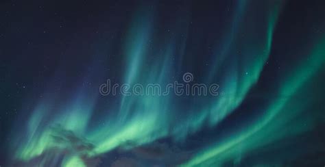 Aurora Borealis Northern Lights Glowing In The Night Sky Stock Photo