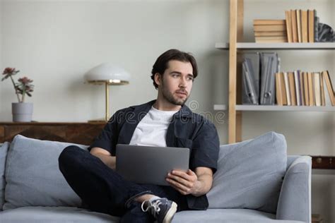 Happy Carefree Young Man Using Computer At Home Stock Photo Image Of