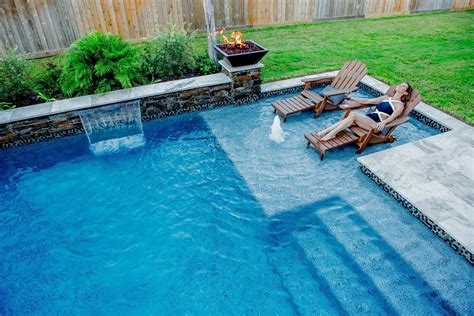 Do Your Relaxing The Right Way In A Stunning Marble Accented Pool