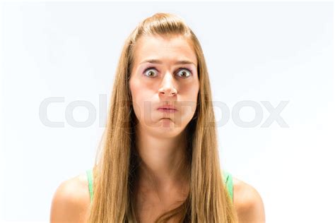 Young Woman Blowing Her Cheek Stock Image Colourbox