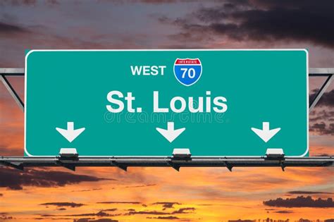 St Louis Interstate 70 West Highway Sign With Sunrise Sky Stock Photo